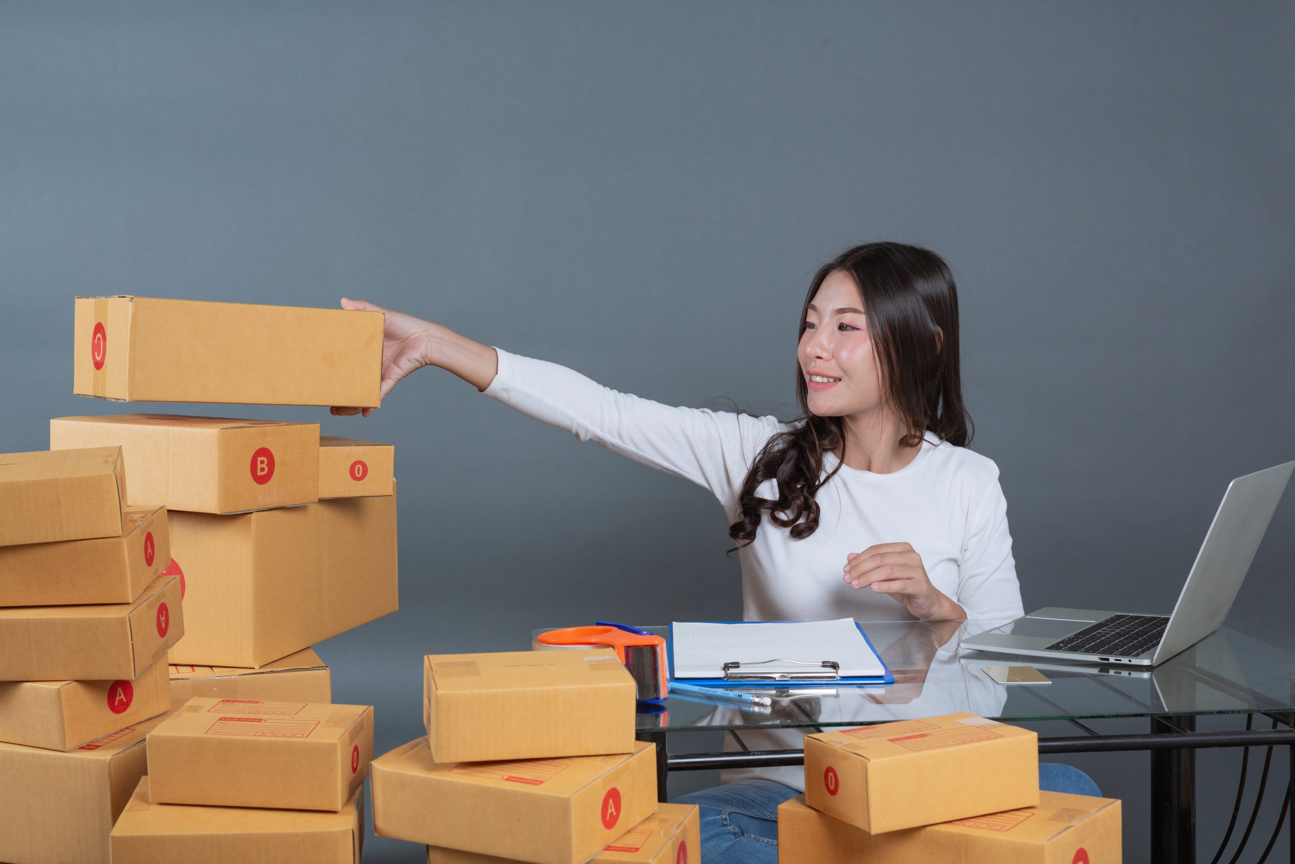 men women are helping pack boxes scaled